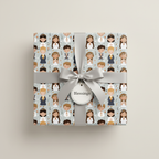 Gift wrapped in light blue blessing wrapping paper with silver ribbon and tag.