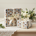 Gifts wrapped in First Communion wrapping paper with a beige ribbon on a wooden table next to white roses.