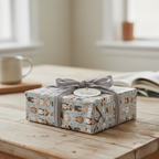 Gift wrapped in gray illustrated wrapping paper with a gray velvet ribbon bow, perfect for unique gift wrap needs.