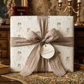 Vintage First Communion wrapping paper with elegant silk ribbon and religious gift tag, by Wrapped Studios.