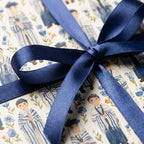 Bar Mitzvah wrapping paper with Jewish holiday watercolor pattern and blue satin ribbon by Wrapped Studios.