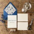 Bar Mitzvah invitation suite with custom illustrated blue envelope liner by Wrapped Studios.