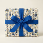 Bar Mitzvah wrapping paper featuring a Jewish boy pattern and royal blue ribbon bow by Wrapped Studios.