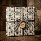Bar Mitzvah wrapping paper with blue Jewish boy pattern and Mazel Tov gift tag by Wrapped Studios.