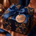 Luxury navy and copper damask gift wrap with a satin ribbon bow by Wrapped Studios.