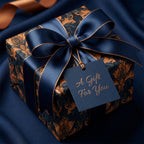 Luxury navy and gold damask wrapping paper with satin bow and gift tag by Wrapped Studios.