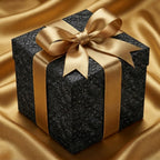 Luxury black embossed floral wrapping paper with a gold satin bow by Wrapped Studios.