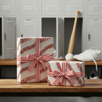 Baseball-themed gift wrap with red-striped ribbon, perfect for a sports fan's birthday present.