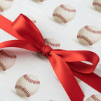 Baseball wrapping paper with a bright red ribbon detail.