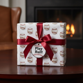 Baseball wrapping paper on a gift with burgundy ribbon. "Play Ball!" gift tag attached.