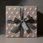 Vintage baseball wrapping paper on a grey gift box with a satin bow by Wrapped Studios.