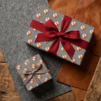 Vintage baseball wrapping paper on sports gift boxes with a red bow by Wrapped Studios.