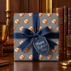 Baseball wrapping paper on a Father's Day gift box with a navy blue bow, by Wrapped Studios.