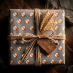 Rustic baseball wrapping paper with twine, dried wheat, and leather tag by Wrapped Studios.
