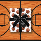 Basketball wrapping paper on a gift with a black bow, "Winning Play" tag.