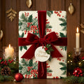 Luxury botanical Christmas wrapping paper with red velvet bow by Wrapped Studios.
