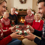 Couple exchanging gift in vintage Christmas wrapping paper with plaid bow by Wrapped Studios.