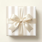 Luxury beige and white striped wrapping paper with a cream satin bow by Wrapped Studios.
