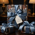 Luxury jellyfish and coral gift wrap with dusty blue ribbon by Wrapped Studios.