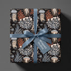 Vintage jellyfish wrapping paper on a gift box with dusty blue satin ribbon by Wrapped Studios.