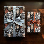 Ocean jellyfish wrapping paper by Wrapped Studios on luxury gifts with satin blue and copper ribbons.