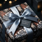 Luxury ocean wrapping paper with jellyfish and coral, tied with a blue satin bow by Wrapped Studios.