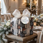 Luxury jellyfish wrapping paper with a white ribbon on a festive holiday table by Wrapped Studios.