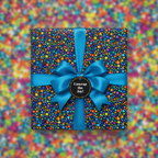 Square gift wrapped in colorful dot patterned paper with a blue satin ribbon and bow.