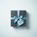 Modern gift wrapped in colorful pebble print wrapping paper, tied with a blue ribbon and "A Small Gift" tag.