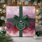Elegant Christmas gift wrap with a watercolor stardust design, green ribbon, and "Happy Holidays" tag.