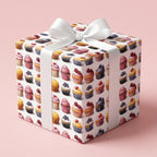 Gift box in cupcake print wrapping paper with white ribbon, perfect for birthday gift wrap.