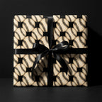 Vintage baseball wrapping paper with a black satin bow on a gift box, by Wrapped Studios.
