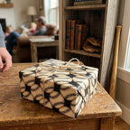 Vintage baseball wrapping paper on a rustic gift box with twine bow, by Wrapped Studios.