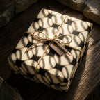 Vintage baseball wrapping paper with rustic twine on a birthday gift box by Wrapped Studios.