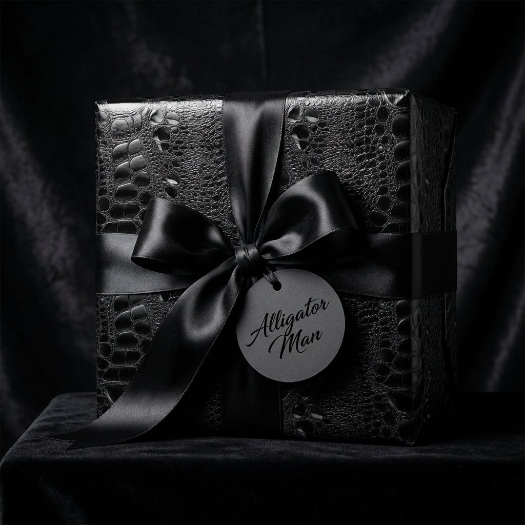 Black luxury gift wrap with an alligator skin pattern and satin ribbon, perfect for elegant birthday presents.