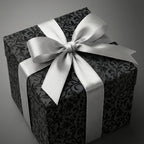 Elegant black floral wrapping paper with silver ribbon.
