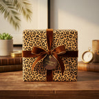 Elegant gift wrapped in animal print wrapping paper with brown velvet ribbon.