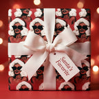 Retro Christmas wrapping paper with glam Black women in Santa hats and a white bow by Wrapped Studios.