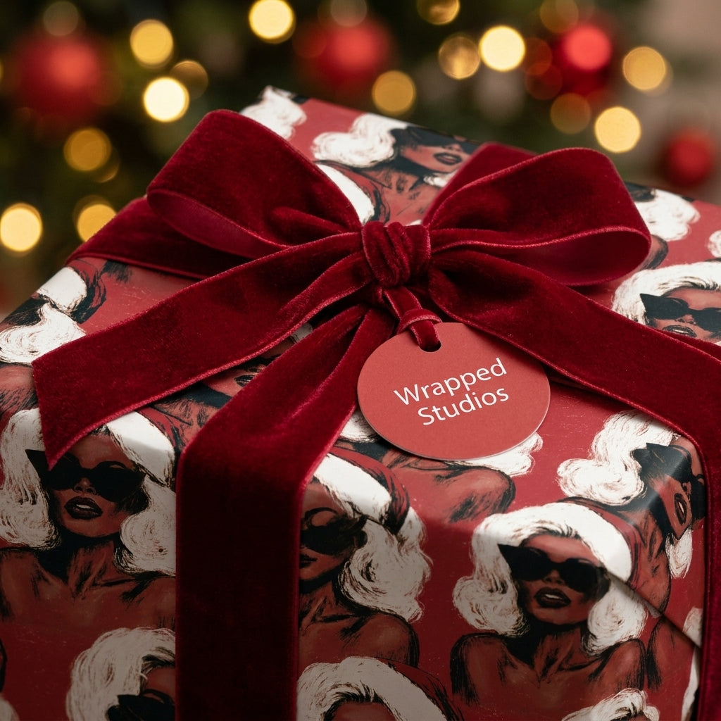 Luxury Christmas gift wrap with chic retro illustration and red velvet bow by Wrapped Studios.