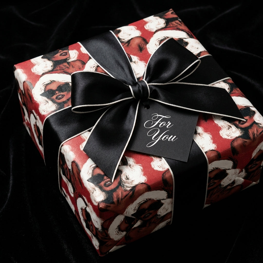 Luxury Black Christmas wrapping paper with chic women in Santa hats and a black bow, by Wrapped Studios.