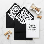 Black paw print envelope liners with puppy shower invitation card by Wrapped Studios.