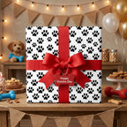 Dog paw print wrapping paper with red bow for pet birthday and gotcha day gifts by Wrapped Studios.