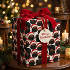 Luxury Black Santa wrapping paper with red velvet ribbon on a Christmas gift by Wrapped Studios.