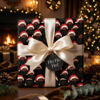 Black Santa Christmas gift wrap with a cream satin bow by Wrapped Studios in a cozy holiday scene.