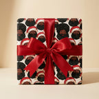 Black Santa Christmas wrapping paper with a red satin bow on a gift box by Wrapped Studios.