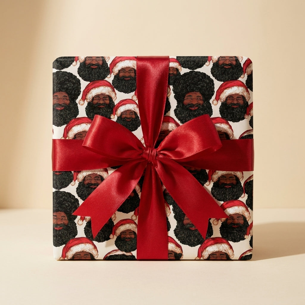 Black Santa Christmas wrapping paper with a red satin bow on a gift box by Wrapped Studios.