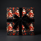 Black Santa wrapping paper with vintage Christmas design and black velvet bow by Wrapped Studios.