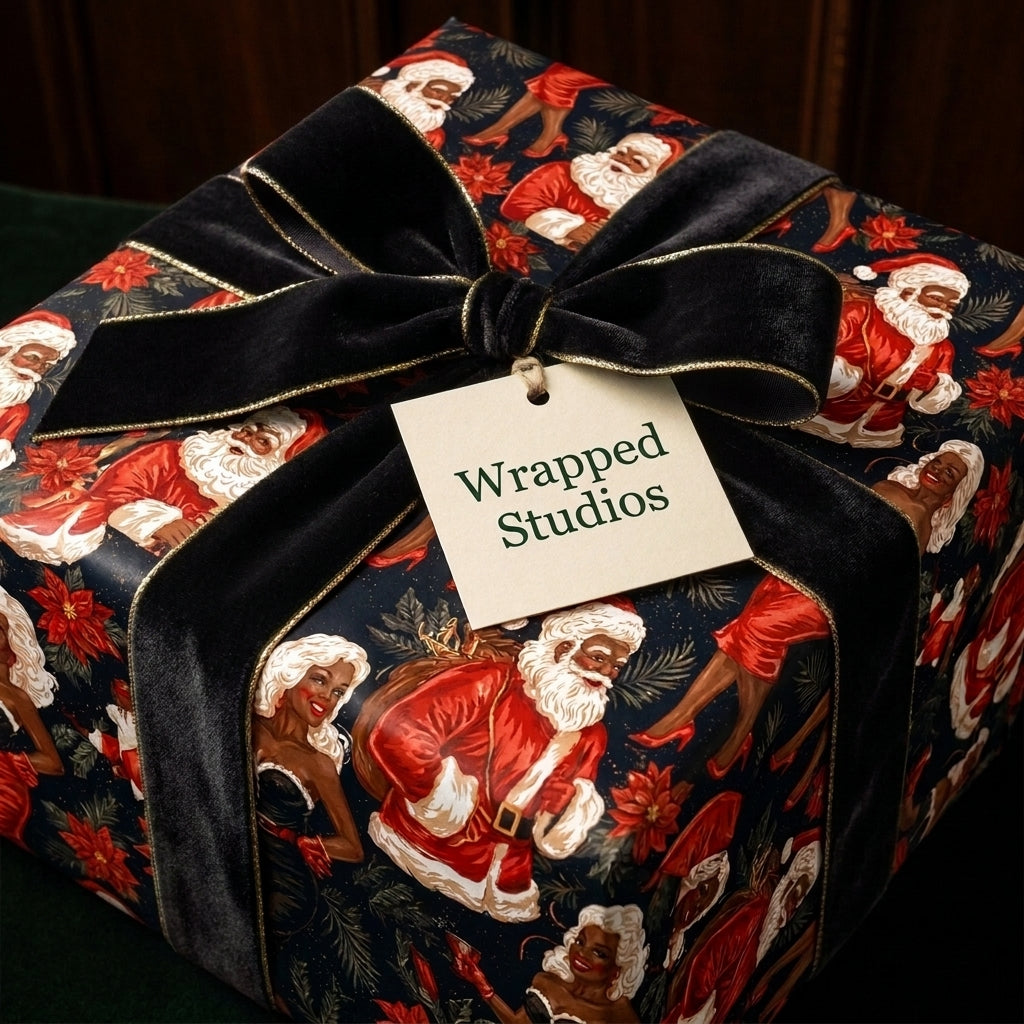 Vintage Black Santa Christmas wrapping paper by Wrapped Studios on a gift box with a luxury black velvet bow.