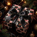 Black Santa luxury Christmas gift wrap with a black satin bow on a holiday gift box, by Wrapped Studios.
