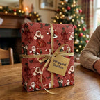 Black Santa Christmas wrapping paper with a gold ribbon by Wrapped Studios in a cozy holiday home setting.